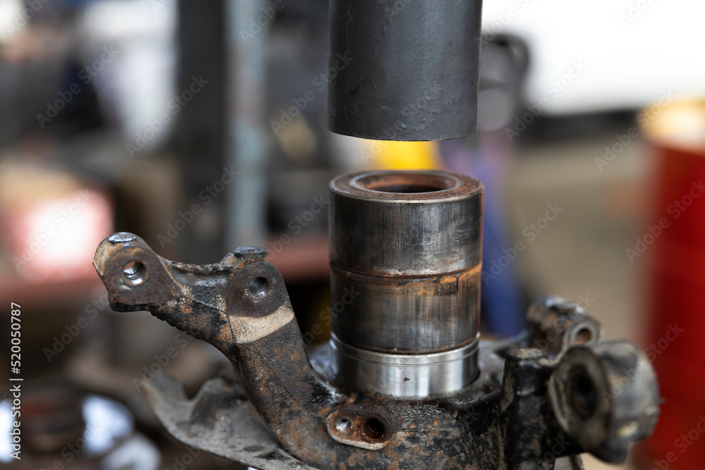 Extracting a Car Wheel Bearing from its Placement with Help of a Hydraulic Press Extracting a Car Wheel Bearing from its Placement with Help of a Hydraulic Press