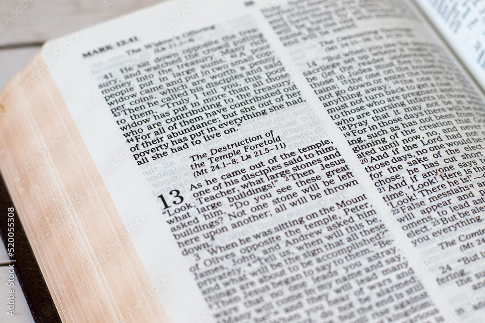 The destruction of the temple in Jerusalem prophecy, new testament biblical verses in an open Holy Bible Book. A close-up. The destruction of the temple in Jerusalem prophecy, new testament biblical verses in an open Holy Bible Book. A close-up.