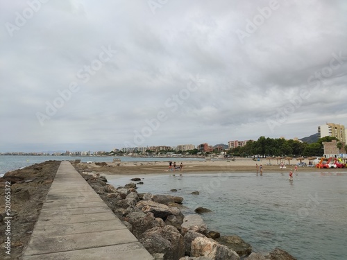 Sea. Beach. Storm. Stormy sky with the sky covered with gray clouds next to the shore of the Mediterranean Sea from the town of Benicàssim, in Castellón. In Spain. Horizontal photography. © Fernando Astasio