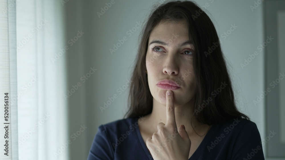 Pensive woman seeking solution to problem. Portrait of thoughtful person seeking inspiration Pensive woman seeking solution to problem. Portrait of thoughtful person seeking inspiration