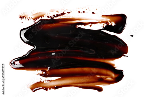 Hot smeared melted chocolate pouring isolated on white background, top view