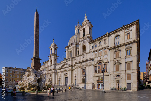 The facade of the church of S. Agnese in Agone and Fontana dei Quattro Fiumi baroque styled fountain in Piazza Navona, Rome