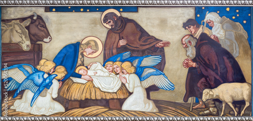 ZURICH, SWITZERLAND - JULY 1, 2022: The fresco of Adoration of Shepherds in the church Pfarrkirche Liebfrauen by Fritz Kunz (1906). photo