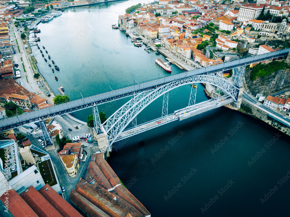 Porto Portugal Aerial View. Dom Luis Bridge at Sunrise. Porto, Portugal. Cityscape of Downtown Touristic Ribeira. Olt Town. Douro River.