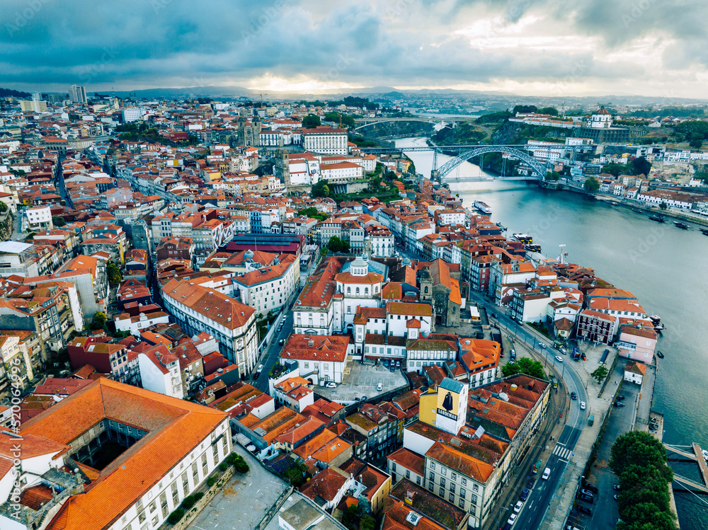 Porto Portugal Aerial View. Dom Luis Bridge at Sunrise. Porto, Portugal. Cityscape of Downtown Touristic Ribeira. Olt Town. Douro River.