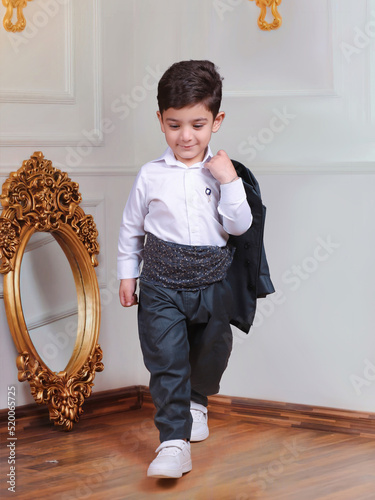 Cute child wears kurdish clothes . Cute kid showing Kurdish clothes photo