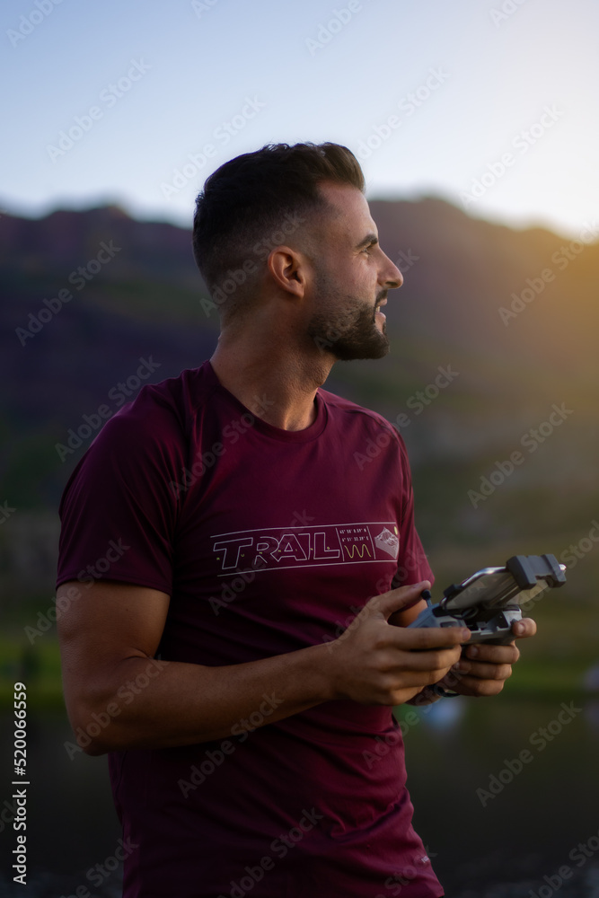 Drone pilot in mountains sunset Drone pilot in mountains sunset