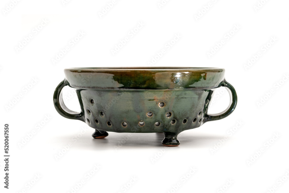 Old used pasta colander isolated on white background. Old used pasta colander isolated on white background.