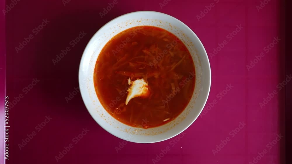 Iconic Ukrainian dish borsch, traditional cuisine red soup with sour cream. High quality FullHD footage Iconic Ukrainian dish borsch, traditional cuisine red soup with sour cream. High quality FullHD footage
