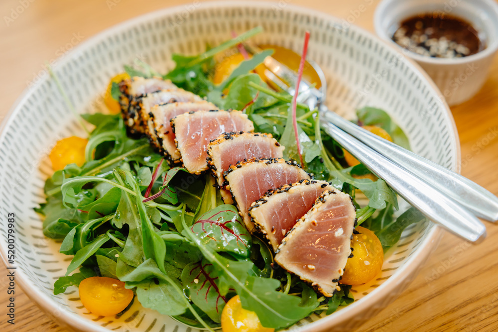 Tuna salad sesame dressing eating menu, clean food healthy good meal protein and vegetable. Tuna salad sesame dressing eating menu, clean food healthy good meal protein and vegetable.