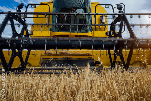 Combine harvester in agricultural field