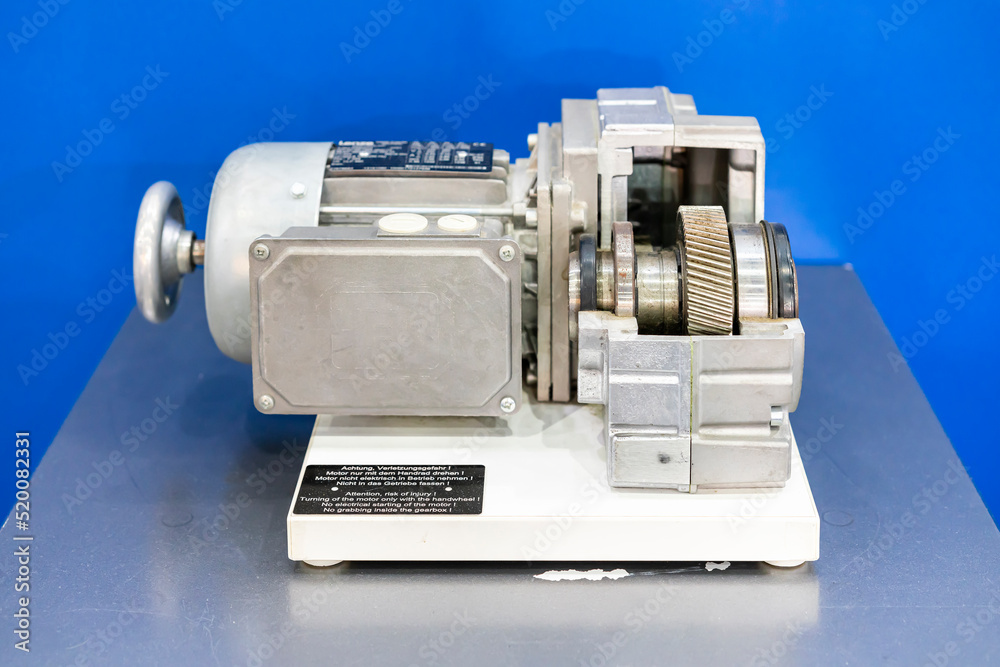 cross section show metal helical gear or cogs gear bearing housing