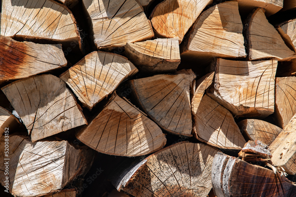 Stack of firewood background. Wooden texture. Stack of firewood background. Wooden texture.