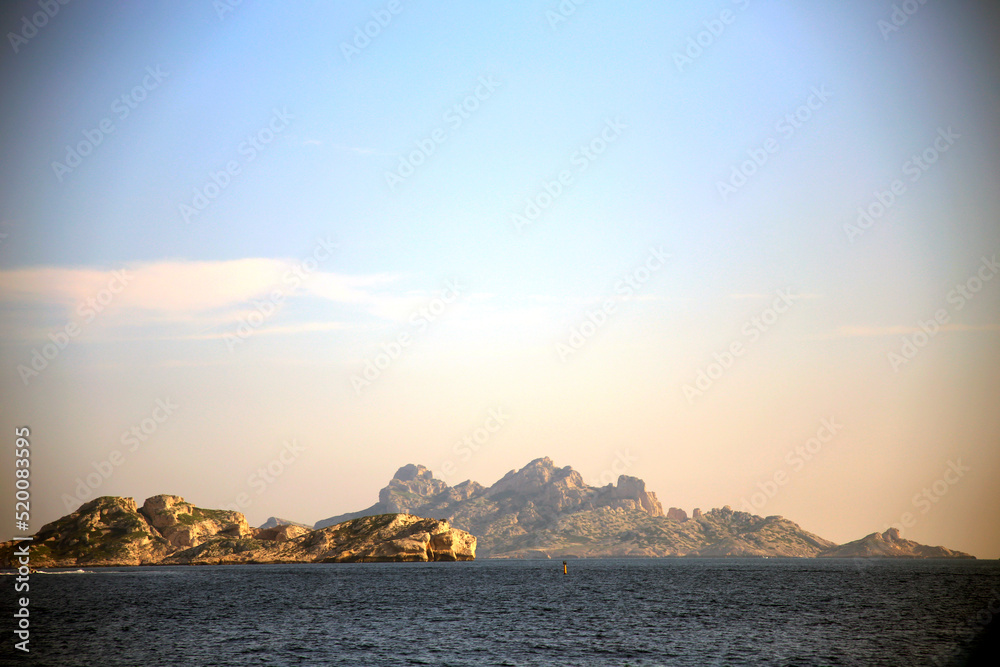 Landscape with jagged islands, in the intense colors of the sea and the sky, Parc National des Calanques, Marseille, France
