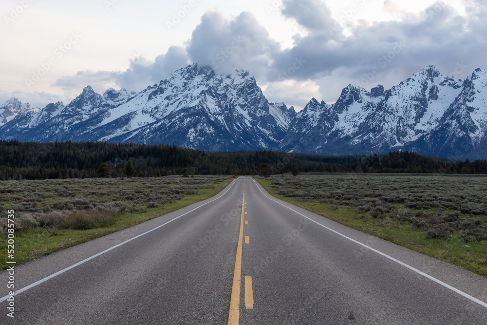 Scenic Road surrounded by Mountains and Trees in American Landscape. Scenic Road surrounded by Mountains and Trees in American Landscape.