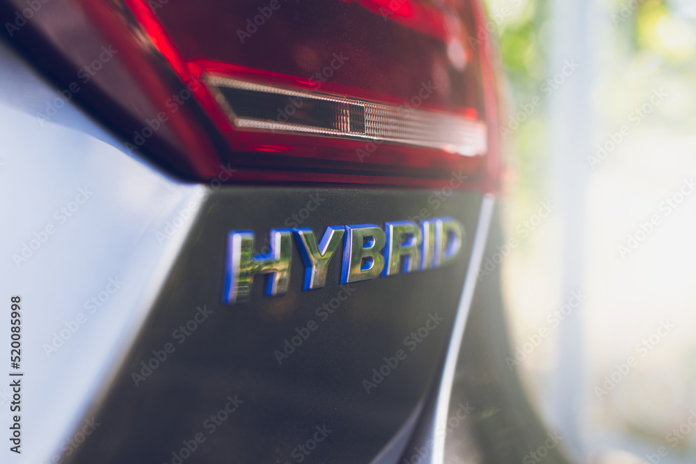 Obraz premium Close-up of Hybrid icon on car body. Environment concept.