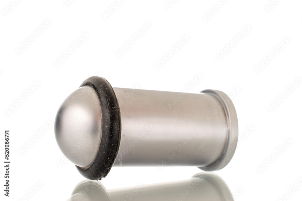 One metal door stop, close-up, isolated on a white background. One metal door stop, close-up, isolated on a white background.