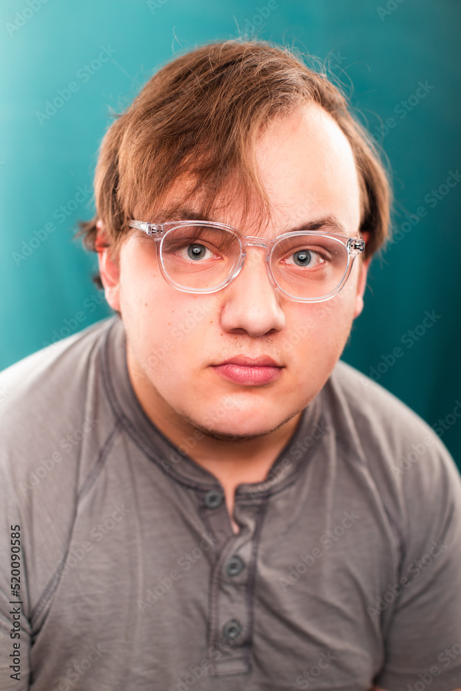 Man with glasses on a green-blue background Man with glasses on a green-blue background