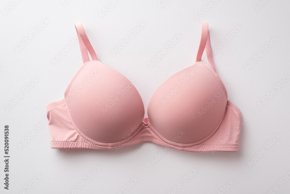 Breast cancer awareness concept. Top view photo of pink brassiere on isolated white background - obrazy, fototapety, plakaty 