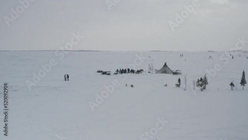 A camp of yurts of a small northern people in the Arctic. Aerial view of the winter landscape of the yurt camp with reindeer