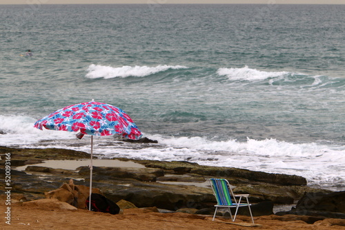 Umbrella for shelter from the sun on the city beach.