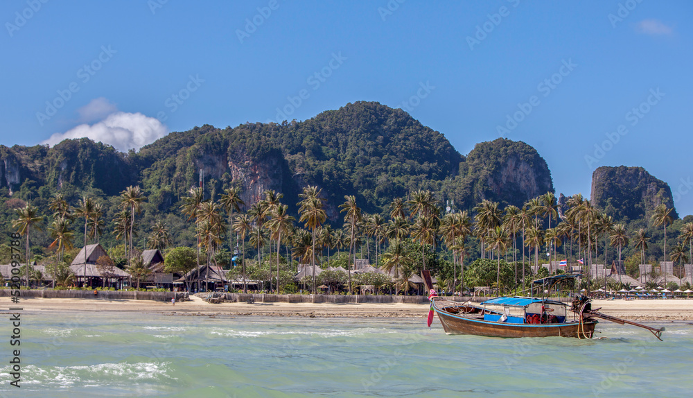Boat near a beach in tropical paradise.