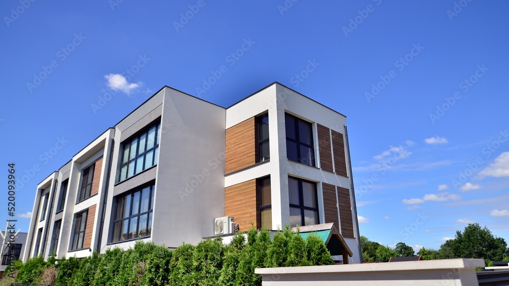 Modern luxury residential flat. Modern apartment building on a sunny day. Apartment building with a blue sky. Facade of a modern apartment building.