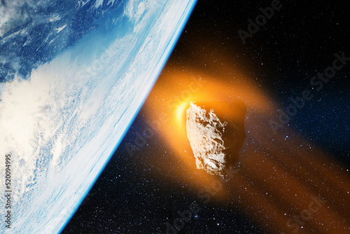 Fototapeta Naklejka Na Ścianę i Meble -  Planet Earth and big asteroid in the space. Potentially hazardous asteroids. Asteroid in outer space near Earth planet. Elements of this image furnished by NASA.
