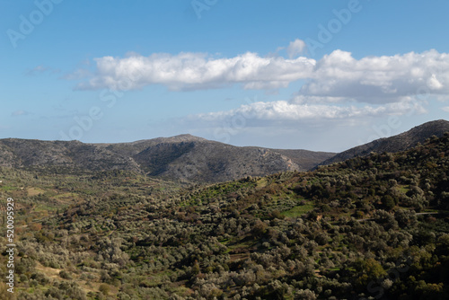 landscape photo of cretan mountains and fields greece