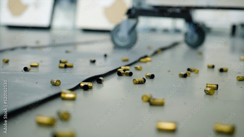 Huge number of shell casings from bullets lying on the floor in the ...