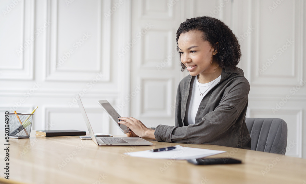 Female student uses laptop computer workplace in coworking space, online learning, working with documents Female student uses laptop computer workplace in coworking space, online learning, working with documents