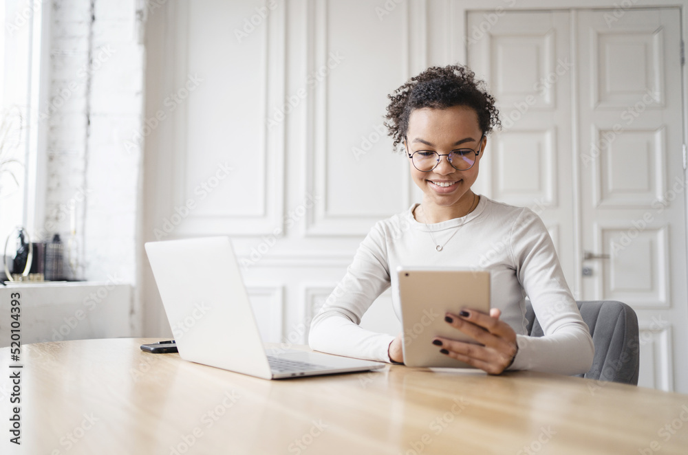 Female student uses laptop computer workplace report in company, online training, working with documents Female student uses laptop computer workplace report in company, online training, working with documents