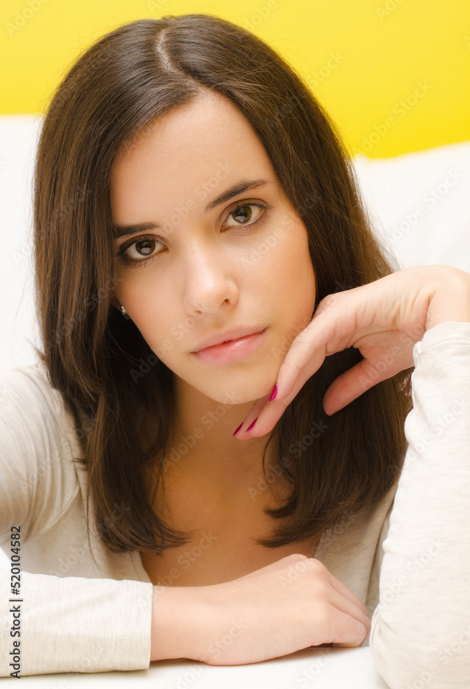 Portrait of beautiful young woman with long brown hair Portrait of beautiful young woman with long brown hair