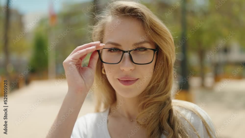 Young blonde woman smiling confident wearing glasses at park Young blonde woman smiling confident wearing glasses at park