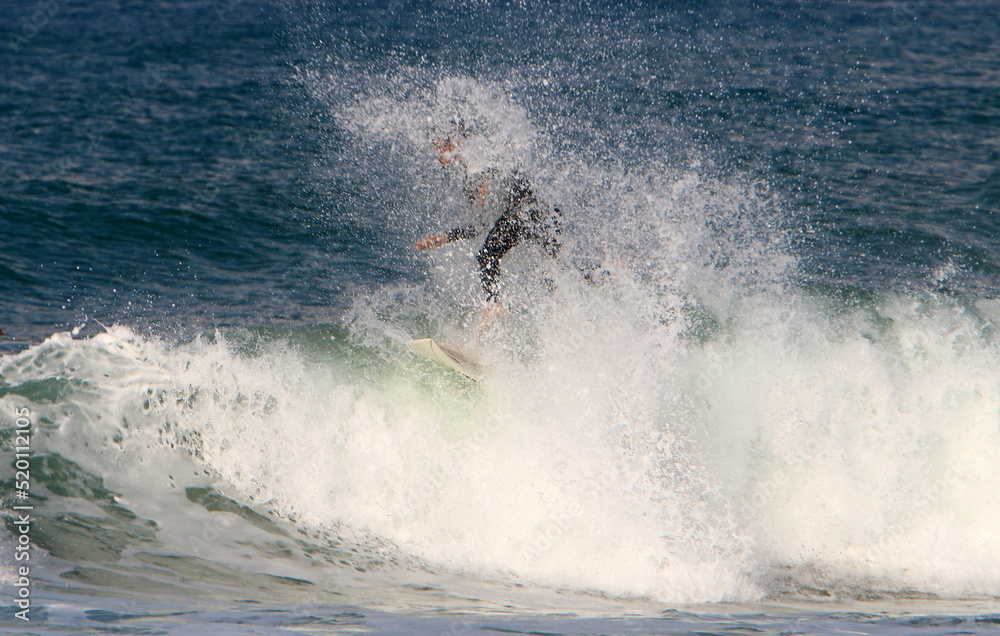 Surfing on high waves in the Mediterranean.