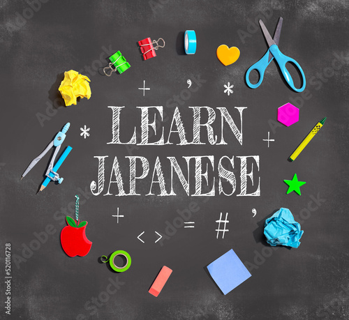 Learn Japanese theme with school supplies on a chalkboard - flat lay