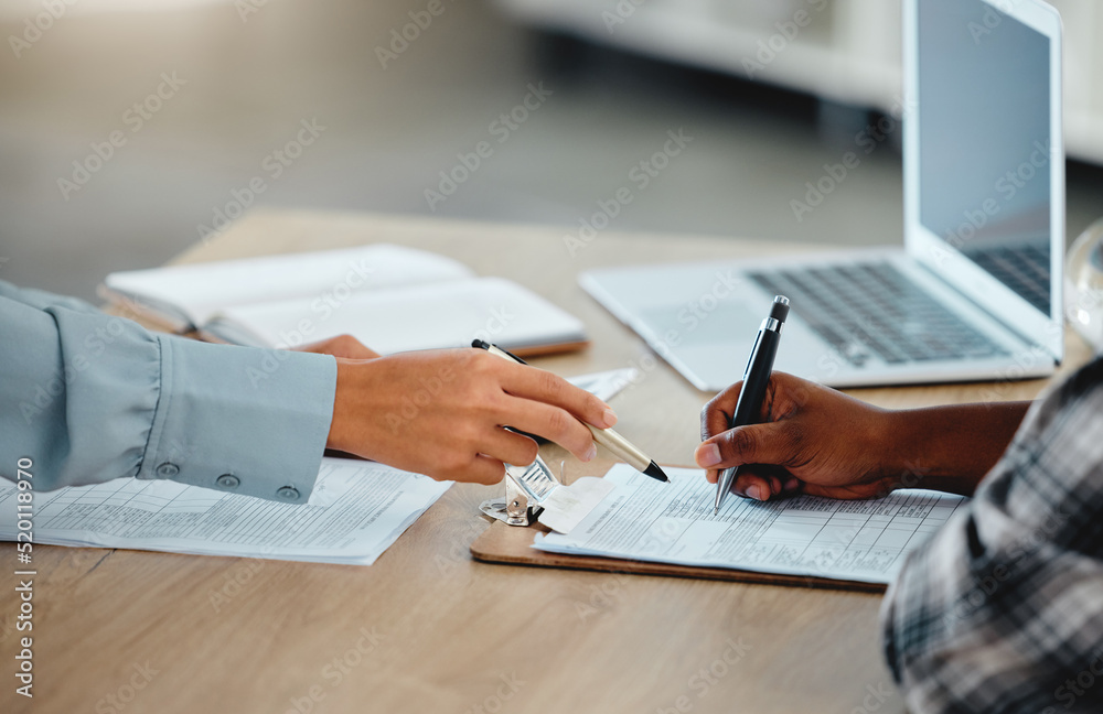Contract, document and paper work closeup of banker with client signing, writing or filling out information on insurance or loan form. Bank worker giving client instruction on banking law agreement Contract, document and paper work closeup of banker with client signing, writing or filling out information on insurance or loan form. Bank worker giving client instruction on banking law agreement