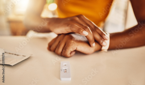 Testing for covid, corona virus or infection with a rapid antigen test kit at home. Closeup of a woman waiting for the result of a screening test to diagnose an illness, sickness or infection