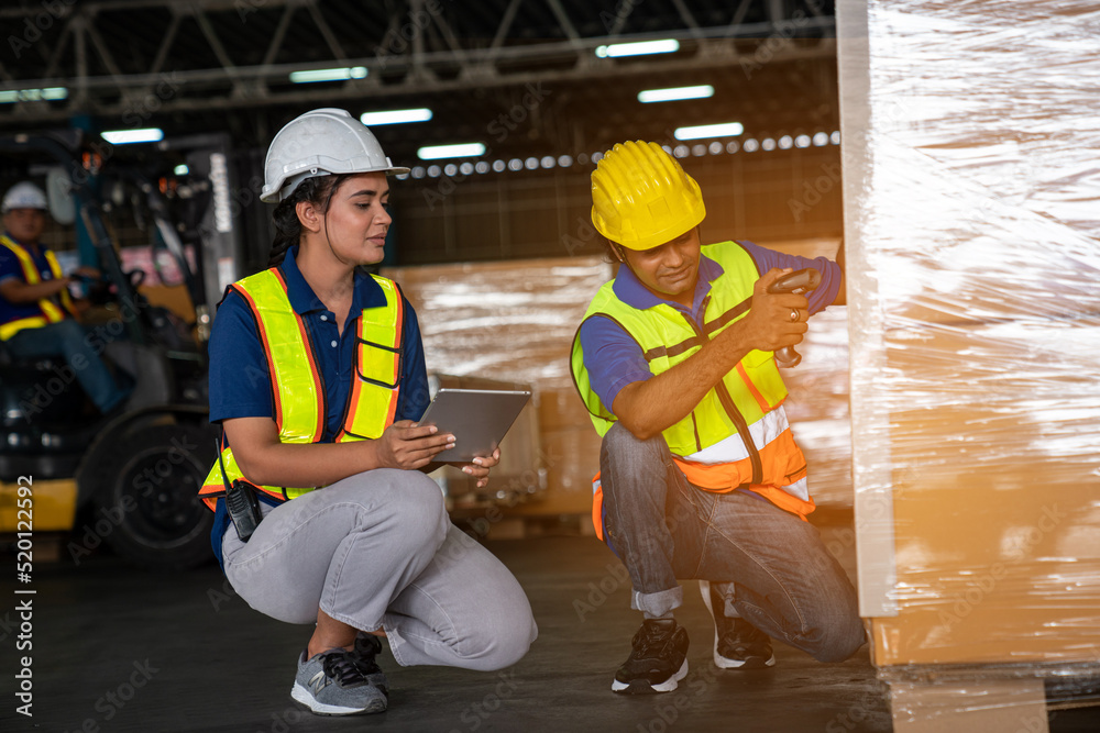 Warehouse employee worker with digital tablet talking on warehouse, Logistic industry concept.