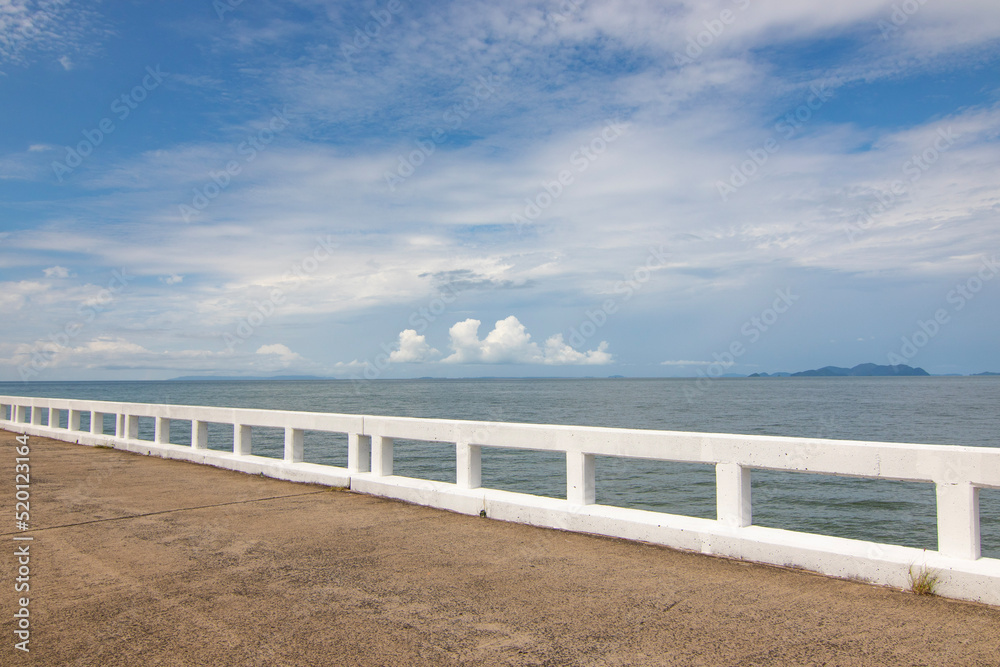 Bridge railing in the sea, see islands in the distance in the sea, pictures for tourism