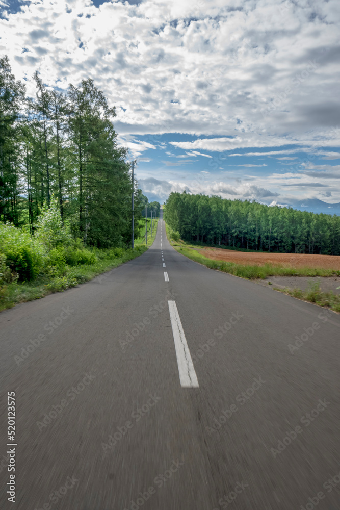 A straight road that goes on forever in Hokkaido Japan
