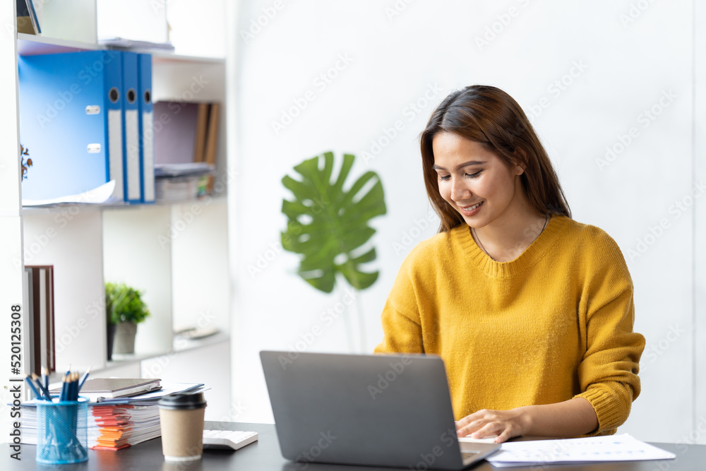 Fototapeta premium Portrait of smile beautiful business asian woman working office desk computer. Small business sme people employee freelance online startup marketing designer telemarketing successful.