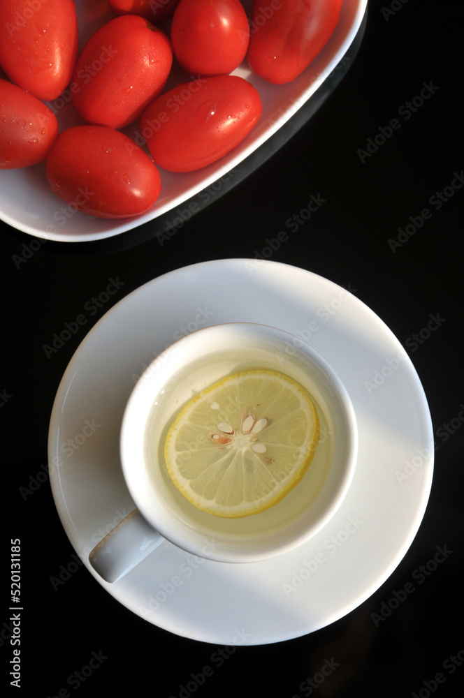 Yellow lemon on the plastic cutting board Yellow lemon on the plastic cutting board
