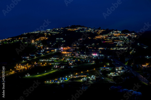 The village in the mountains at night. Small village in high mountains in Thailand.