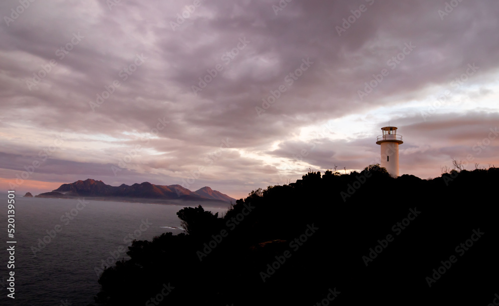 white lighthouse at the freycinet national park Tasmania Australia