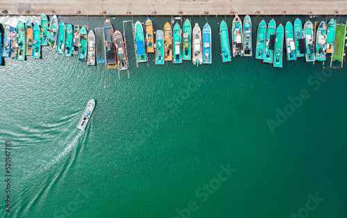 Aerial view of fishing boats at harbor
