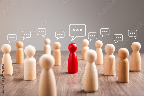 Wooden figurine with speech bubble. Mingle, discussion, chatting concept