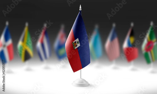The national flag of the Haiti on the background of flags of other countries