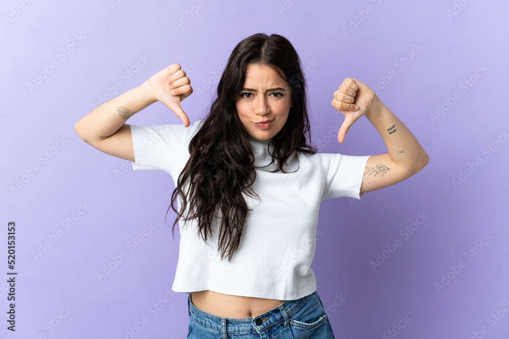Young caucasian woman isolated on purple background proud and self-satisfied
