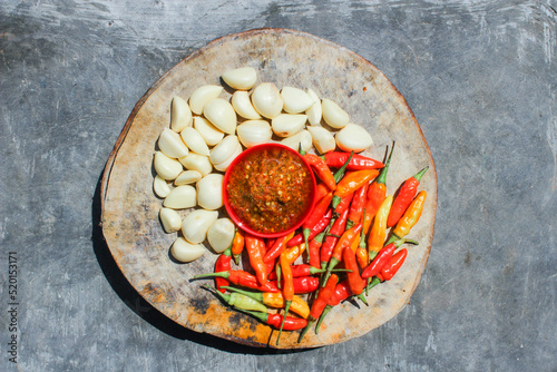 Indonesian garlic chilli sambal or sambel bawang with garlic, chilli and salt as Ingredients. authentic traditional sambal or chilli paste from indonesia. photo